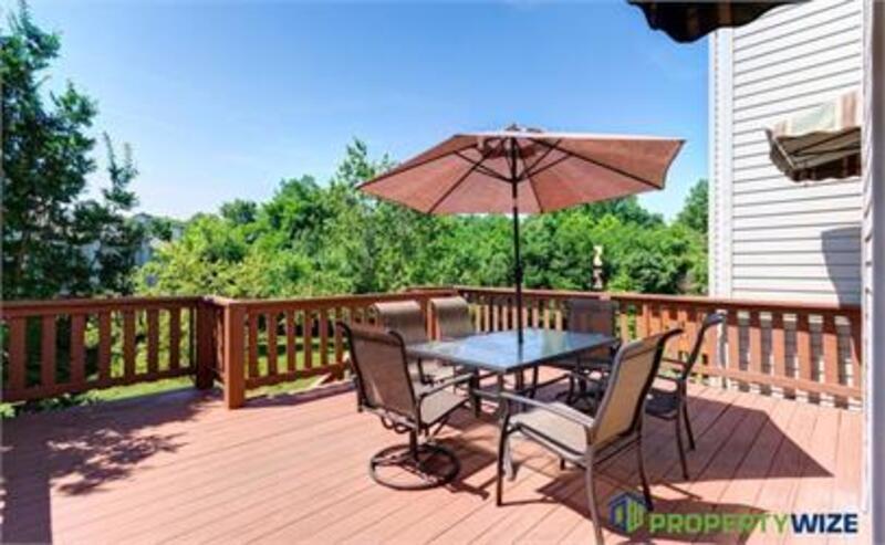 Natural light fills this Woodland Village home! Features garage parking, master suite, updated 2 full baths at top floor and powder room at 1st floor. property image