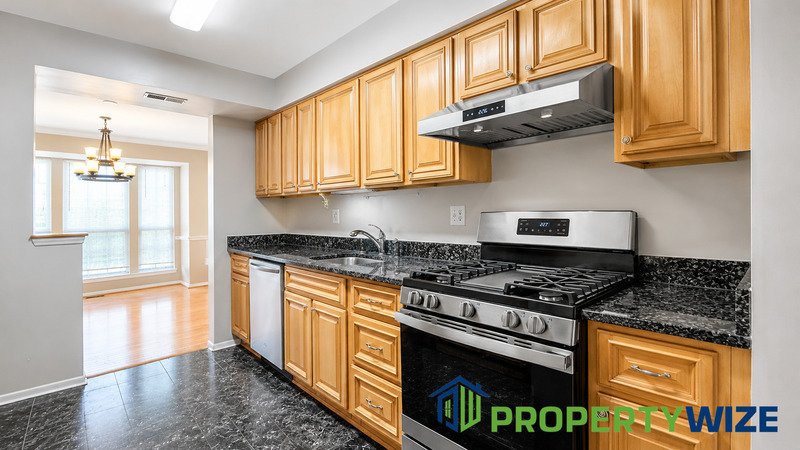 Natural light fills this Woodland Village home! Features garage parking, master suite, updated 2 full baths at top floor and powder room at 1st floor. property image