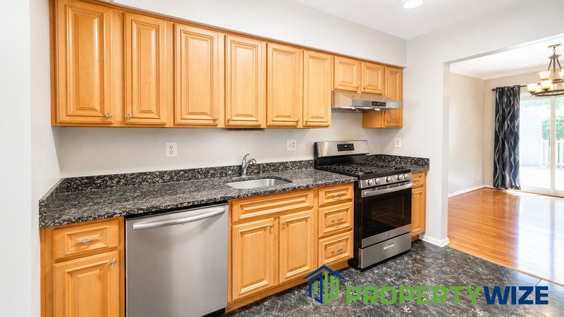 Natural light fills this Woodland Village home! Features garage parking, master suite, updated 2 full baths at top floor and powder room at 1st floor. property image
