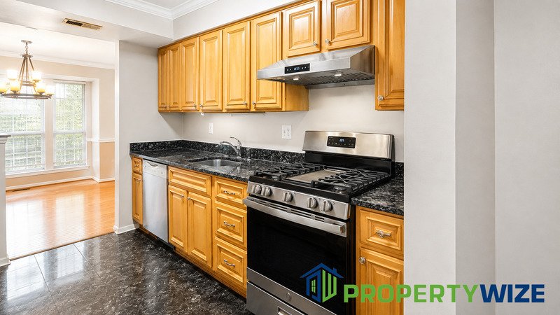 Natural light fills this Woodland Village home! Features garage parking, master suite, updated 2 full baths at top floor and powder room at 1st floor. property image