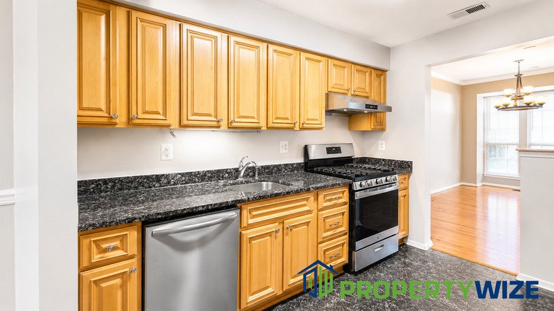 Natural light fills this Woodland Village home! Features garage parking, master suite, updated 2 full baths at top floor and powder room at 1st floor. property image
